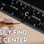 Castillo Heritage Crafts branded centering ruler on a dark surface demonstrating use with 